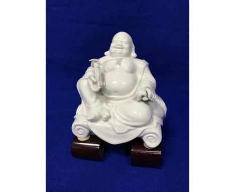 WHITE CERAMIC CHINESE BUDDHA FIGURE ON WOODEN STAND
