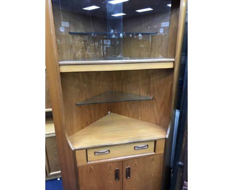 MID-20TH CENTURY G PLAN TEAK CORNER CUPBOARDthe glass shelved top enclosed by two sliding glass doors, open recess below with