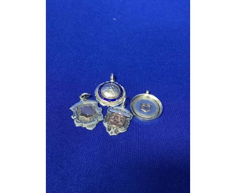 FOOTBALL INTEREST: FOUR SILVER FOBSone with blue enamel, including Southall and District League, inscribed Winners 1948-49, e