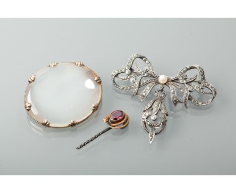 VICTORIAN CHALCEDONY BROOCHof oval form, unmarked; along with an early twentieth century marcasite brooch in the form of a bo