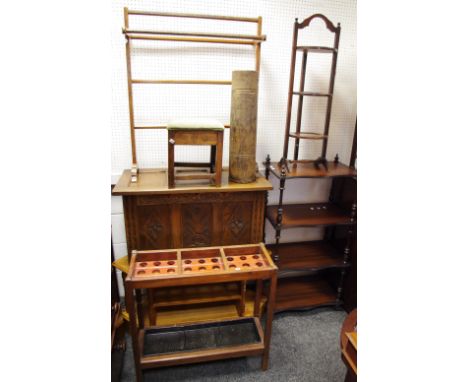 An oak three tier cake stand; an early 20th century towel rail; an oak  blanket box, three carved panel front; a pine TV stan