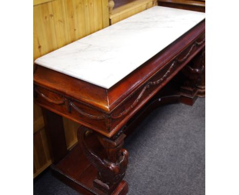 A large Empire style Duchess console table, moulded rectangular marble top, outswept frieze with moulded harebell swags, fore