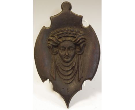 A 19th century carved panel, in relief with a Classical mask wearing a diadem