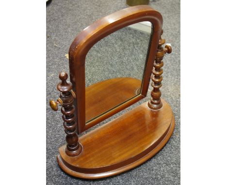 A Victorian mahogany dressing table mirror, bobbin turned supports, arched base c.1860 