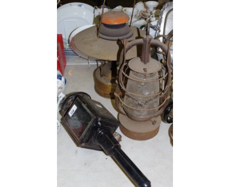 A oil hurricane lantern Bat D.R Patent 2850 Made in Thuringia Germany; a Tilly Lamp Model X 246; a Victorian carriage lamp