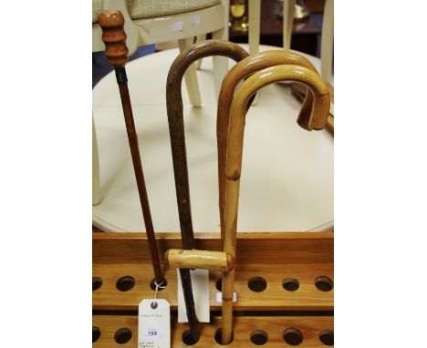 Walking sticks - two crooks; an market stick; a walking pole; another (5)