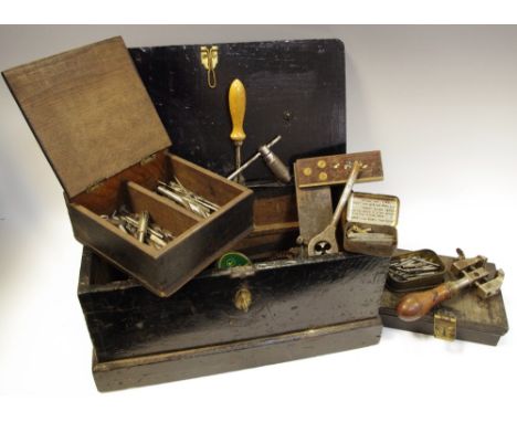 Tools - a small early 20th century tool ebonised toolbox holding early tins with drill bits, screws, early 20th century ruler