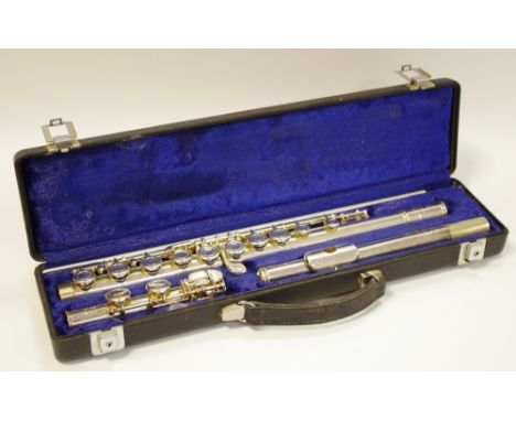 A Boosey &amp; Hawkes, London 'Emperor' silver plated flute, cased; a music stand. (2)