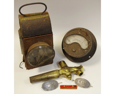 Railwayana - a LMS brass beer tap; a LMS cap badge; another Great Western Railway Co. cap badge; a brake van tail lamp; a loc