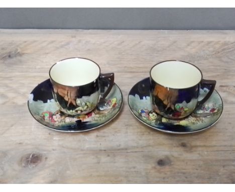 A pair of Royal Doulton Gnomes and Munchkins cups and saucers by Charles Noke, as found.  