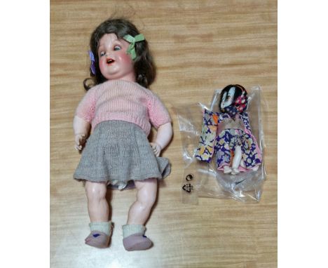 Two vintage dolls; 1930s Singer doll 'Jeannette' and a Japanese Geisha doll of a similar age.  