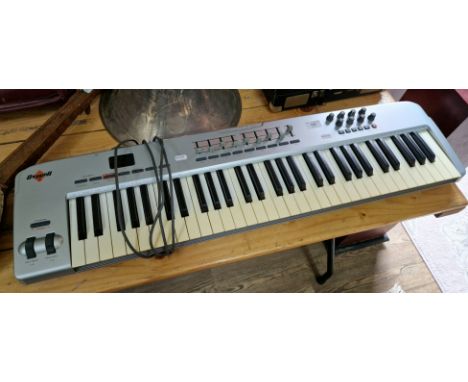 A synthesizer controller keyboard 'M-Audio Oxygen 61' USB midi controller.  
