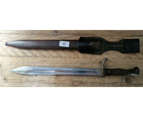 A German WW1 butcher blade bayonet with metal scabbard and leather frog, marked Josua Corts Sohn Remscheid, W15 on edge of bl