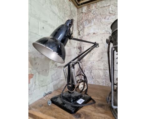 A black Herbert Terry &amp; Sons Anglepoise lamp on two step base.
