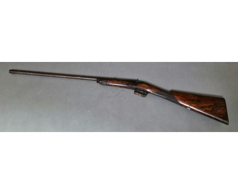 An antique percussion rifle with curved walnut butt, 101cm long, barrel sealed. Note:- no in-house P&P available on this lot.