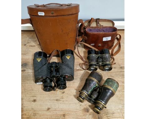 Three pairs of vintage binoculars, one WWII Canadian and two WWI era.  