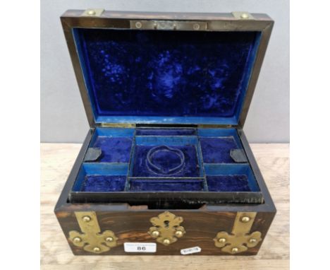 A 19th century coromandel and brass bound jewellery box.Condition:- General wear through age and use, some blemishes & light 
