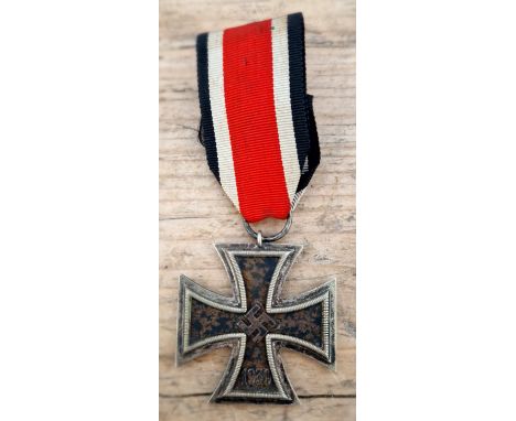A German WWII Iron Cross, 2nd class, marked 1939.  Possible mark on suspension ring. We believe this to be genuine wartime er