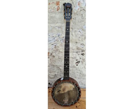 A vintage B.B. Mandard Quality four string banjo.  