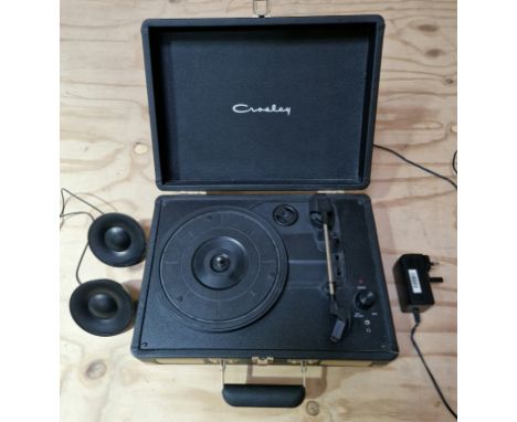 A Crossley portable record player and Philips speakers.  