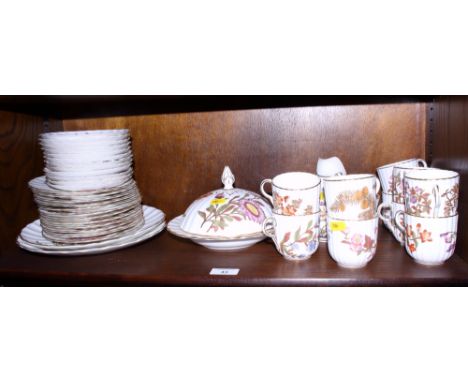 A Royal Worcester blush ivory porcelain fluted combination service in the Aesthetic style, decorated with floral sprays and g