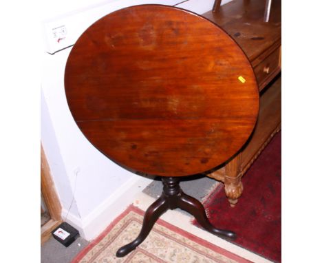 An early 19th century mahogany circular tilt top table with birdcage, on turned column and tripod splay support, 28" dia