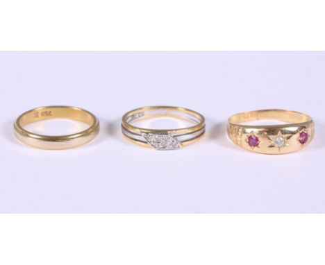 An 18ct gold ruby and diamond gypsy ring, an 18ct yellow and white gold diamond ring and an 18ct gold ring