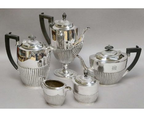 A George V Silver Teapot, Birmingham, 1928,  oval, the lower body part fluted, engraved with an inscription, 28.5cm wide; Tog