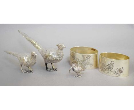 Two Silver Model Pheasants, a Silver Model Woodcock and a Pair of Napkin-Rings, the pheasants with English import marks for L