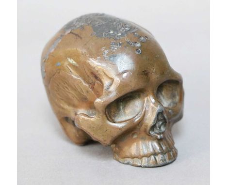 A Small Bronzed Lead Skull, 20th century, 5cm