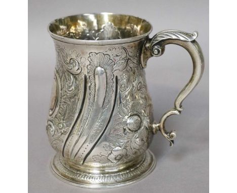 A George II Silver Mug, by Thomas Whipham and Charles Wright, London 1757, baluster and on spreading foot, with leaf-capped s