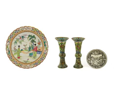 A Japanese Porcelain Charger, Meiji period, painted in famille rose style enamels with figures reading a scroll in a garden w