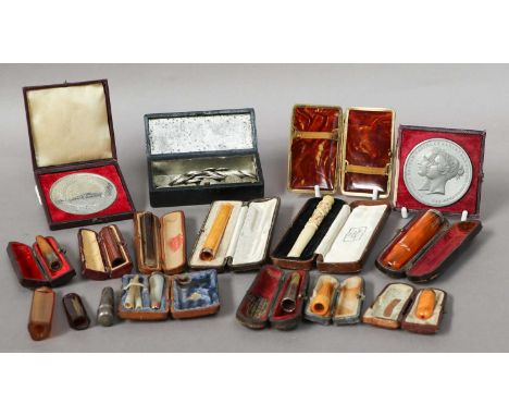 A Collection of Assorted Silver or Gold-Mounted Cigarette-Holders, most in original or associated cases; Together With a bras