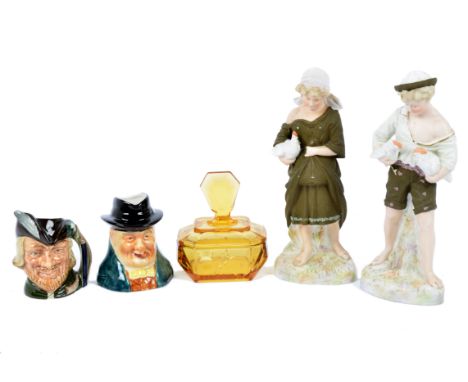 A group of Toby and character jugs, including Royal Doulton 'The Trapper', 'Beefeater', and 'Robin Hood'; together with a col