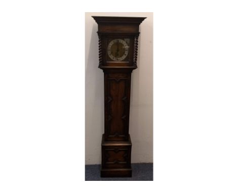 A 1930s oak cased grandmother clock, brass square dial, silvered chapter ring, eight day movement, dial flanked by barley-twi