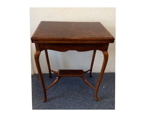 A late 19th Century walnut card table, swivel and hinged figured and crossbanded top, revealing green baize playing surface a