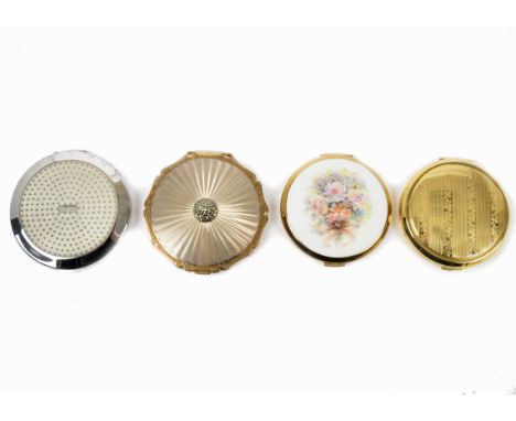 Four Stratton circular compacts, including a 1950s engine turned 'Queen' compact with gold tone edging and a central marcasit