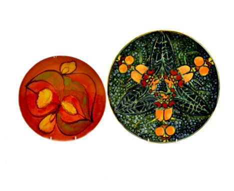 A modern Poole Pottery Studio charger by Tony Morris, painted with radiating dragonfly in orange, red, yellow, and green, 199