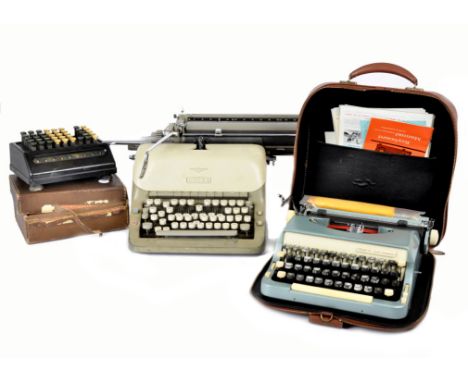 A 20th Century Imperial 'Good Companion' portable typewriter, in sea green finish, with original leaflets and a brown leather