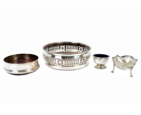 A modern silver wine bottle coaster by R. Carr Ltd, Sheffield, 2001; together with a George VI silver egg cup by E. W. Haywoo