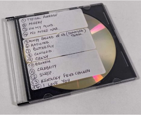 An audio CD marked in pen 'Ed's CD' and with three stickers to case bearing handwritten track titles. The CD contains 14 trac