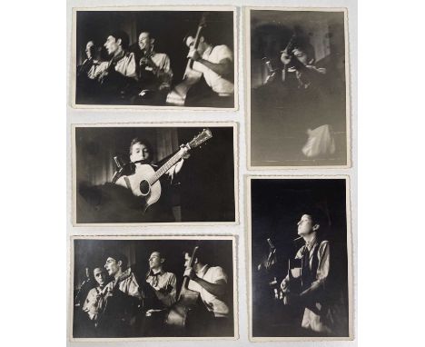 Three photographs (each 8.5 x 13.5cm) depicting Bob Dylan performing onstage at 'Gerdes Folk City' in New York City, c Septem