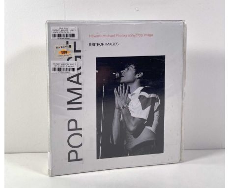A folder with approx 190 black and white 35mm negatives, 34 x 6x4" black and white prints, 4 contact test sheets - all depict
