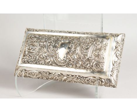 A GOOD RECTANGULAR SILVER BOX, embossed with theatrical masks and flowers. London 1897.  Maker:  William Cummings.  11ins lon