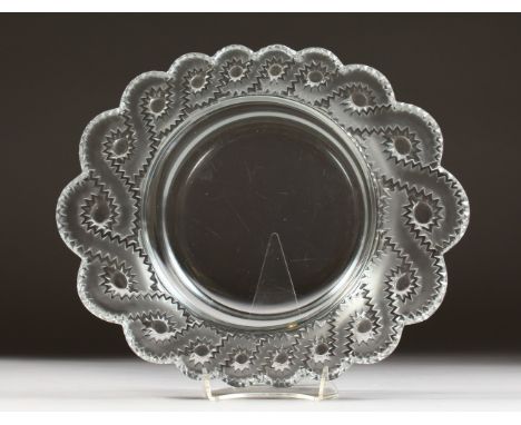 A HEAVY CIRCULAR LALIQUE DISH, with scalloped sides. Etched LALIQUE, FRANCE.  11ins diameter.