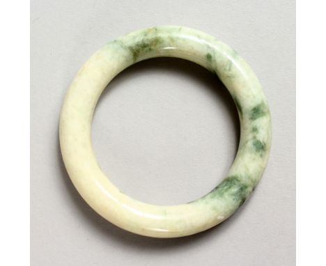 A PALE JADE BANGLE.