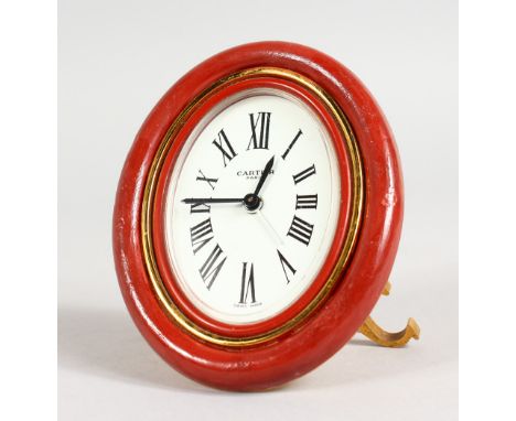 A CARTIER OF PARIS EASEL CLOCK, 3.5ins high, in a red Cartier case.