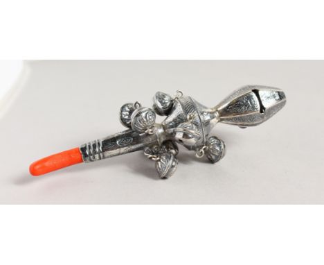 A SILVER AND CORAL BABIES RATTLE.