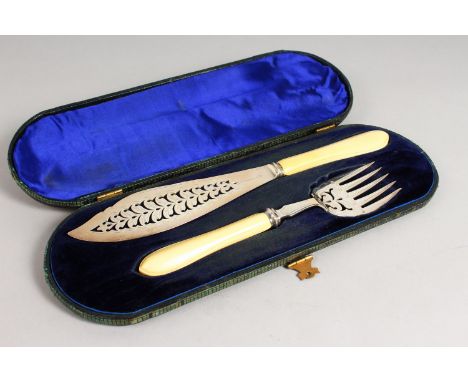 A PAIR OF SILVER CASED FISH SERVERS, with ivory handles. Sheffield 1868.