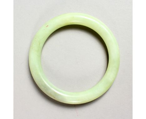 A PALE JADE BANGLE.